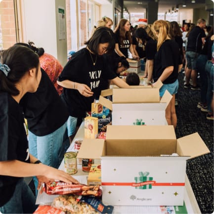 Volunteers packing boxes