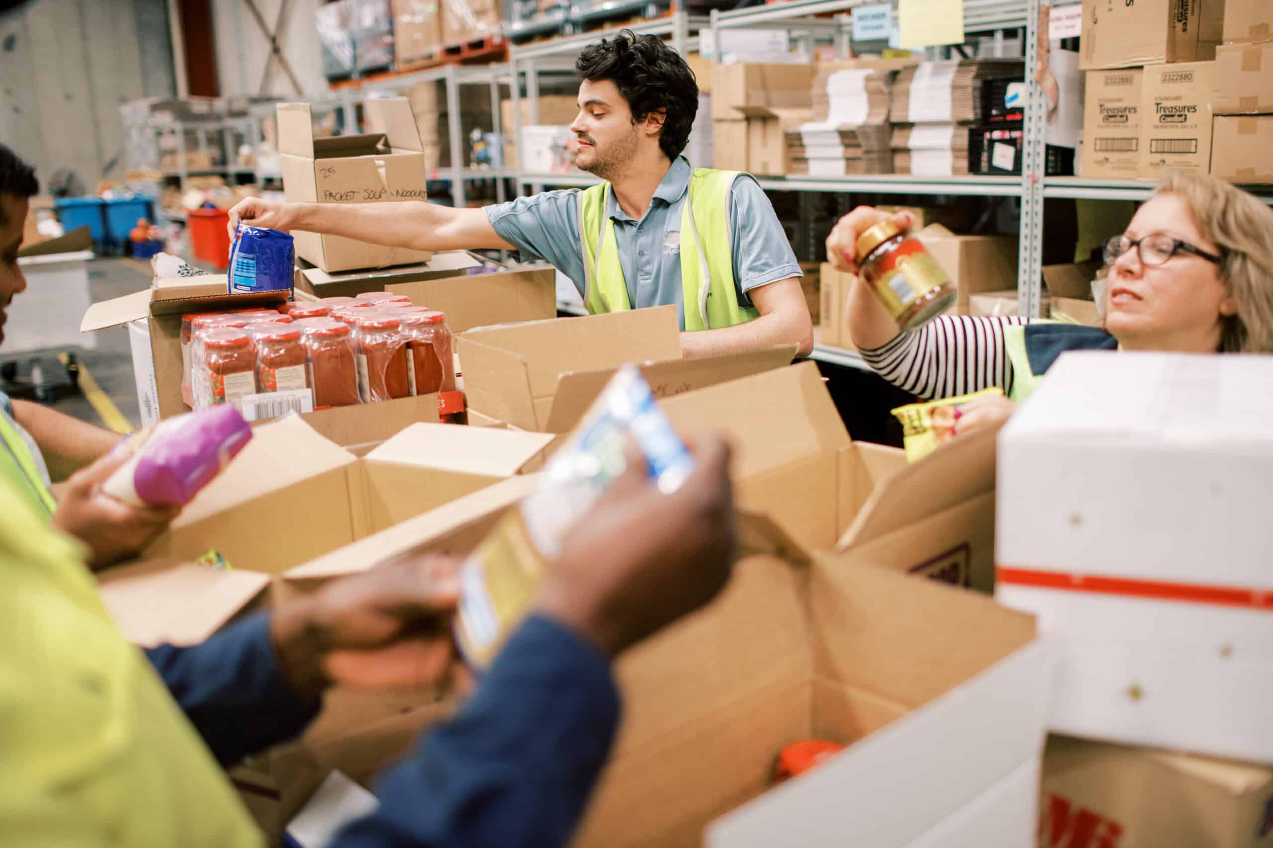 Volunteers helping in the warehouse